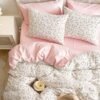 Unyqoos® Omkeerbare beddenset met botanisch patroon in roze en wit microvezel