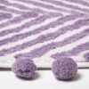 550x550-20112.jpg Unyqoos® Stijlvolle lila badmat met zigzagpatroon en speelse pompons