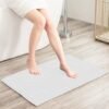 Unyqoos® Zachte en Absorberende Chenille Badmat met Antislip en Machinewasbare Eigenschappen (40 x 60 cm, Wit)