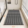 Unyqoos® Zwarte antislip badmat met voetmassage en afvoergat voor douche en badkuip