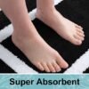 550x550-23389.jpg Unyqoos® Zwarte hoogpolige badmat met antislip en wasbare microvezels 60x120 cm