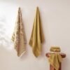 Unyqoos® Luxe 6-delige handdoekenset met omkeerbaar jacquard ontwerp in goud