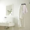 550x550-27520.jpg Unyqoos® Ruimtebesparende wandhouder voor strijkplank en meer in wasruimte