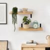 550x550-28480.jpg Unyqoos® Set van twee eikenhouten zwevende wandplanken met zwarte klemmen