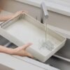 550x550-34537.jpg Unyqoos® Uitschuifbaar en verstelbaar opbergrek voor keuken en badkamer organisatie