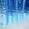 Unyqoos® Blauw douchegordijn met 3D waterkubus effect en roestvrije ogen