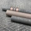 Unyqoos® Zwart vliesbehang met betonlook voor moderne woon- en slaapkamers