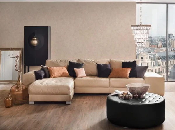 Unyqoos® Hoogwaardig vliesbehang met natuurlijke pleisterlook in zand en beige
