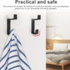 P-87213231058086-20260406114743.webp Unyqoos® Set van 4 zwarte wandhaken voor efficiënte opbergruimte in huis
