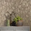 Unyqoos® Hoogwaardig vliesbehang met glanzende goud en bruin betonlook afwerking