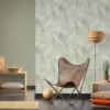 Unyqoos® Lichtgroen vliesbehang met elegante structuur voor diverse woonruimtes