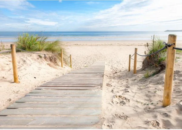 Unyqoos® Hoogwaardig vliesbehang met strand en zee motief voor een serene sfeer