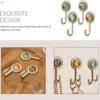 P-872135885673710-20260406120423.webp Unyqoos® Set van 8 zelfklevende vintage wandhaken voor veelzijdig gebruik